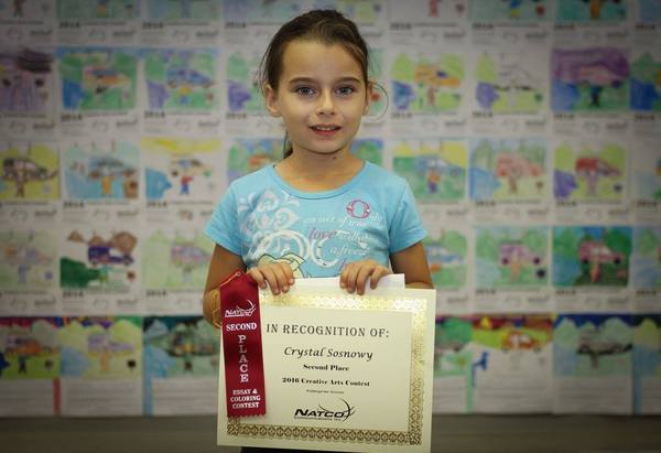 K 2nd Crystal Sosnowy holding her certificate