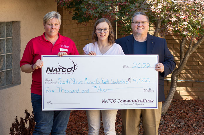 NATCO Owner and Employee holder large check for $4,000 made out to South Shore Marion County Youth Leadership